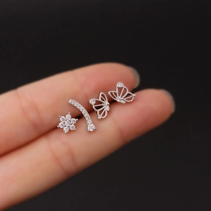 Silver stainless steel ear stud set featuring flower, curved bar, and butterfly designs