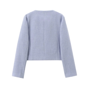 Detail view of the light blue cropped blazer in textured tweed fabric showing the back seam