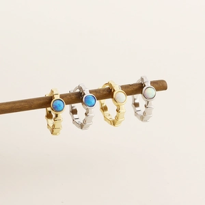 Detailed view of bamboo-shaped S925 silver earrings with blue and white opals