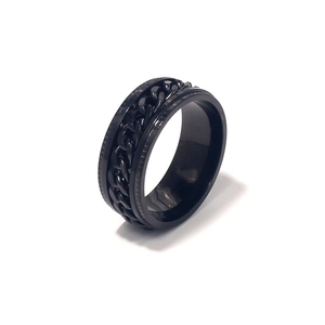Close-up of black rotatable stainless steel chain ring for men with polished finish