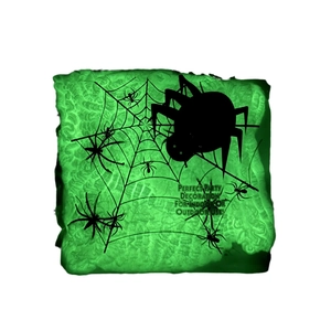 Luminous green Halloween spider web decoration for indoor or outdoor party scene setups