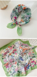 Close-up of fruit green floral cotton linen scarf showing delicate print and fabric texture