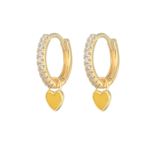 Detail of gold heart earrings with yellow enamel and sparkling zircon stones