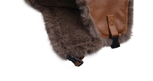 Close-up of thick brown faux fur and leather strap with plastic buckle on earflap hat