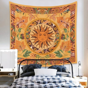 Bohemian Sun and Moon Tapestry with mandala patterns hanging over a bedroom bed