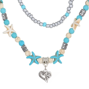 Collana multistrato bohémien con ciondoli a stella marina e cuore traforato