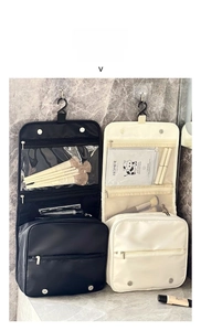Detail of hanging toiletry bag showing multi-layer compartments and waterproof material