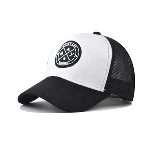 Detail view of the breathable black mesh back and structured panel of the trucker hat