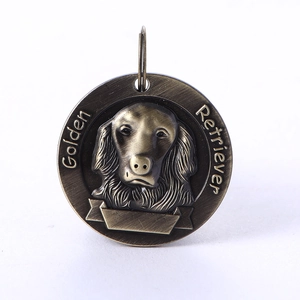 Detailed relief of Golden Retriever head on vintage bronze pet ID tag with blank name plate