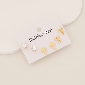 Three-pair set of stainless steel stud earrings featuring gold crosses, bows, and cubic zirconia