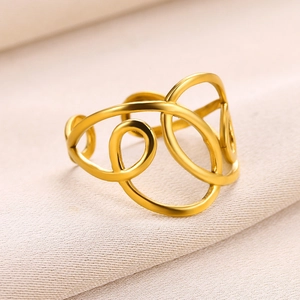 Detail of 18K gold plated stainless steel irregular multilayered open ring on fabric