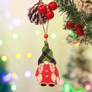 Detailed close-up of a wooden gnome ornament with red and green plaid on a Christmas tree