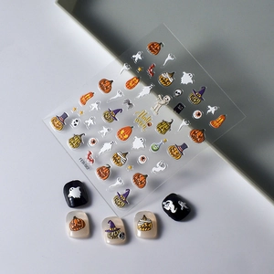 3D Halloween nail art stickers with pumpkin, ghost and bat motifs on white background