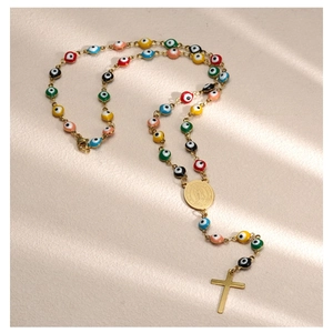 Detail of colorful evil eye rosary necklace with gold Virgin Mary and cross pendants