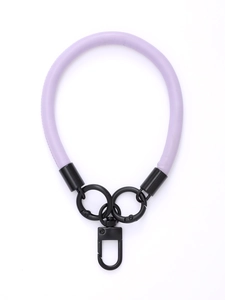 Close-up of light purple leather wrist strap with black metal lobster clasp and rings