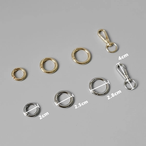 Polished gold and silver metal spring O-rings and lobster clasps in various sizes
