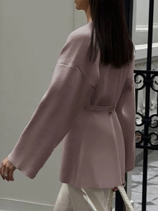 Side view of elegant loose-fit long sleeve mauve shirt with waist belt for women
