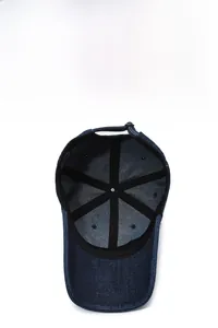 Detailed view of dark blue denim baseball cap showing sweatband and inner structure