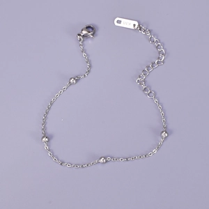 Detail of silver titanium steel bead bracelet with lobster clasp and adjustable chain
