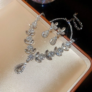 Macro shot of sparkling silver drop jewelry set with crystals in luxury gift box