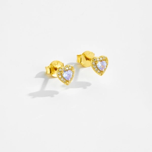 Macro shot of S925 silver gold-plated heart stud earrings with purple gemstone and crystals