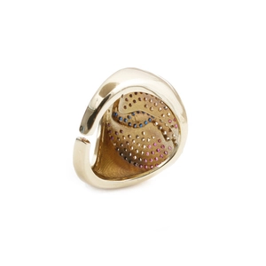 Detailed view of woodpecker ring with colorful zircon stones on gold-plated band