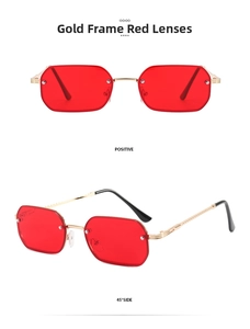 Detail of rimless gold frame sunglasses with red lenses and engraved metal temples