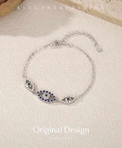Detail of S925 sterling silver evil eye bracelet with blue and white cubic zirconia