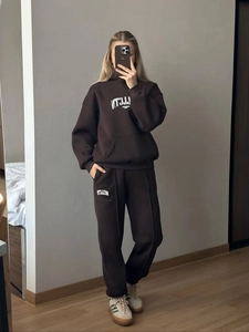 Mirror selfie showing the texture of dark brown hoodie set and Italia print detail