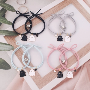 Ghost charm magnetic couple bracelets in black, gray, pink, and light blue woven rope
