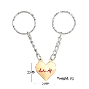 Magnetic heart keychain for couples with gold heartbeat engraving and size detail