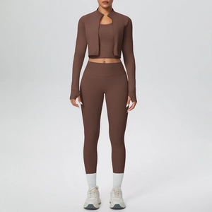 Detailed view of chocolate three-piece yoga set with zip jacket, vest and leggings