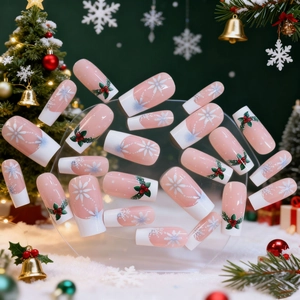 Christmas press-on nails with white French tips, snowflakes, and holly berry patterns