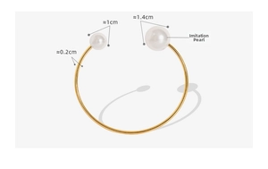 Detail of 18K gold plated steel bracelet with 1.4cm and 1cm faux pearls on white background