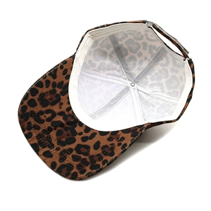 Detailed view of leopard print baseball cap interior with white lining and adjustable strap