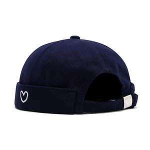 Navy blue docker hat with white heart embroidery and adjustable metal buckle strap