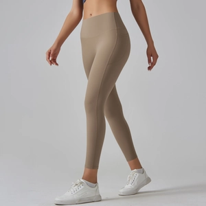 Detailed view of high-waisted yoga leggings featuring side pockets and seamless hem