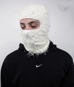 Detailed view of white long-hair plush balaclava knit mask for thermal protection