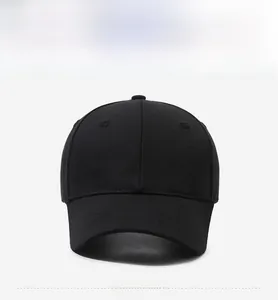 Front view of a minimalist black cotton baseball cap with a classic six-panel design