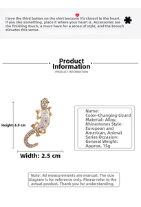 Detailed view of crystal lizard brooch with dimensions 6.9cm by 2.5cm and gold alloy base