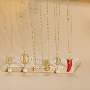 Collection of 14K gold plated necklaces featuring virgin Mary, cross, and chili pendants