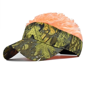 Detail of camouflage baseball hat with pink fluffy wig hair for party and outdoor use