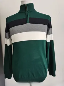 Detail of slim fit men's half-zip knit sweater with color-block stripes and stand collar