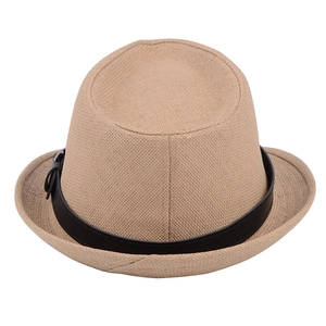 Detail of khaki straw fedora showing fine weave texture and black leather band with buckle