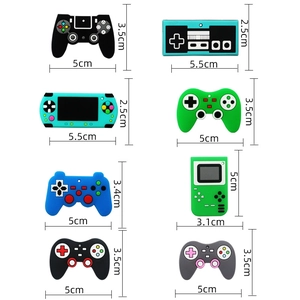 Colorful silicone gaming controller straw toppers featuring various retro game console designs