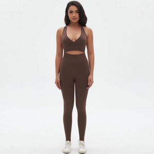 Women's cross-front cutout sports bra and high-waist peach lift yoga leggings set in brown
