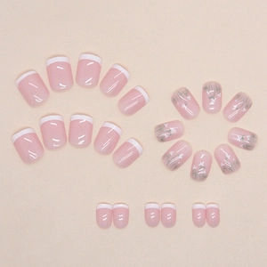 Short square press-on nails with white floral hand-painted designs and French tips