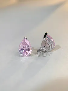 Detailed macro view of S925 silver pink teardrop stud earrings with secure butterfly backs
