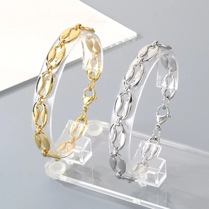 Detail of coffee bean link chain bracelets in gold and silver plating with lobster clasp