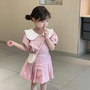 Pink girls' summer outfit with bubble sleeves and a handmade pearl beaded crossbody bag